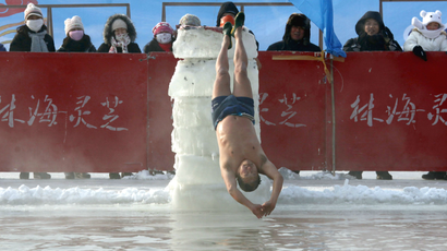 DATE IMPORTED:January 04, 2011A man dives backwards off a ice block into a pool carved out of the thick ice covering the Songhua River in the northern city of Harbin, Heilongjiang province January 4, 2011. The swimming display is part of the Harbin International Ice and Snow Festival which will be officially launched on January 5. REUTERS/David Gray