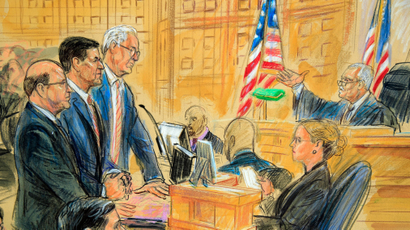 This courtroom sketch depicts former President Donald Trump's former national security adviser Michael Flynn, standing center, flanked by his lawyers, listening to U.S. District Judge Emmet Sullivan, right, as he addresses Flynn and points to the American flag inside the federal court in Washington, Washington, Tuesday, Dec. 18, 2018. Sullivan agreed to postpone Flynn's sentencing so he can continue cooperating with the Russia probe.