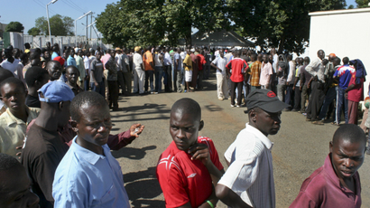 Kenyans line up to vote in one of the primaries leading up to today's election.