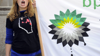 A Greenpeace activist protests outside the BP Canadian offices.