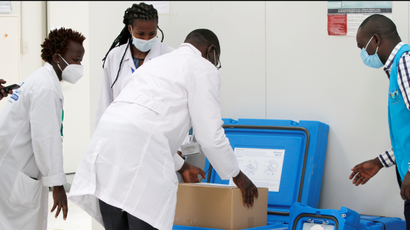 Biomedical engineers pack a consignment of AstraZeneca/Oxford vaccines from COVAX in Nairobi in March.