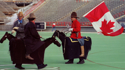 canada climate change global warming emissions November 27, 1993Participants in the annual Grey Cup parade, dressed as cowboys and a Mountie, chat with each other prior to the parade in Calgary November 27, 1993. The parade and opening ceremonies were being held on the eve of the 81st Grey Cup pitting the Edmonton Eskimos against the Winnipeg Blue Bombers. SCANNED FROM NEGATIVE REUTERS/Jeff Vinnick
