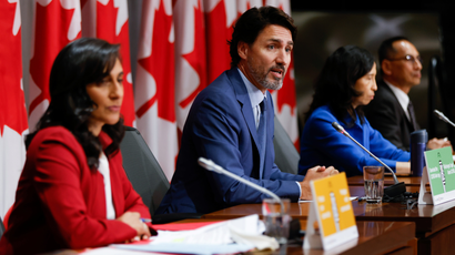 Canada's Prime MinisterJustin Trudeau, with trusted officials: Dr. Theresa Tam, Canada's Chief Public Health Officer (right) and Anita Anand (left), minister of public services and procurement.