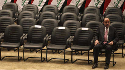 Iraq's Prime Minister Nouri al-Maliki sits alone at the Iraq parliament in Baghdad.