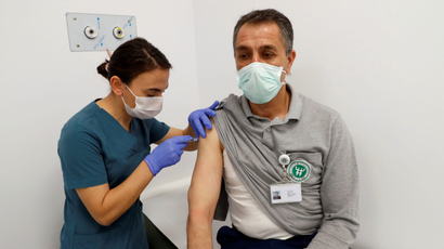 A volunteer in Turkey is injected with an experimental Covid-19 vaccine.