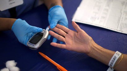 A person receives a test for diabete