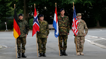 NATO states soldiers of Germany, Norway, the Netherlands and the U.S. stand to attention.