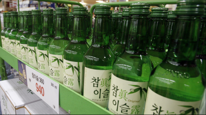 DATE IMPORTED:January 9, 2008A man walks past bottles of "soju", a popular traditional liquor manufactured by Jinro, on display at a market in Seoul January 9, 2008. South Korean liquor maker Jinro filed an application with the Seoul bourse on Wednesday for a relisting of the company in the second half of 2008, which bankers involved in the deal say may be worth over $1 billion. REUTERS/Lee Jae-Won