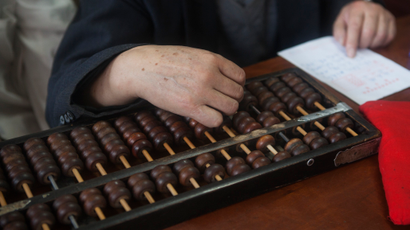 Man working with an abacus