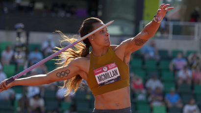 Chantae McMillan throws in the women's javelin with an Olympic rings tattoo on her right bicep during the US Olympic Team Trials