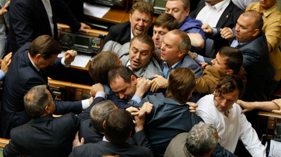 Ukrainian parliamentary deputies tussle during a session in Parliament in Kiev July 22, 2014. REUTERS/Alex Kuzmin (UKRAINE - Tags: POLITICS TPX IMAGES OF THE DAY) - RTR3ZN1B