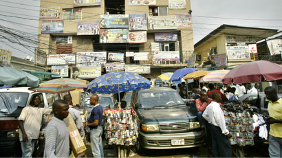 People buy telephones and computer software at the computer village in Lagos, Nigeria.
