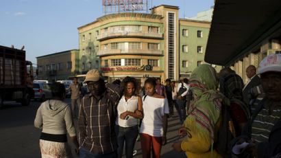 People walk on a busy street in Addis Ababa,