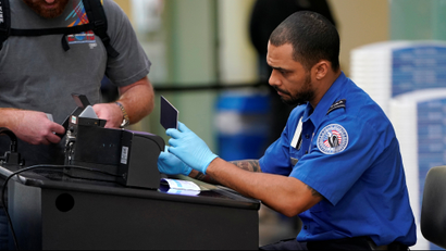TSA agent checks document