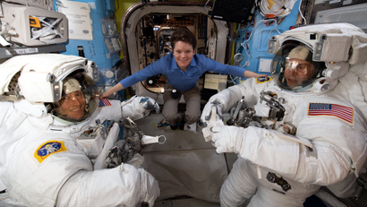 iss059e001093 (March 18, 2019) --- NASA astronaut Anne McClain assists fellow NASA astronauts Christina Koch (left) and Nick Hague as they verify their U.S. spacesuits are sized correctly and fit properly ahead of a set of upcoming spacewalks.