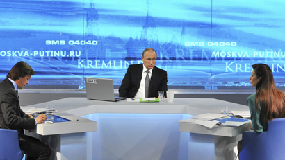 Russian President Vladimir Putin takes part in a live broadcast nationwide call-in in Moscow April 16, 2015.