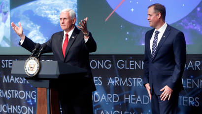 Vice President Mike Pence, left, gestures while speaking during the swearing-in ceremony for Jim Bridenstine, right, as the Administration of the National Aeronautics and Space Administration (NASA) during a ceremony, Monday, April 23, 2018, at NASA Headquarters in Washington.