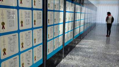 A visitor looks at Apple patents displayed at the World Intellectual Property Organization headquarters in Geneva
