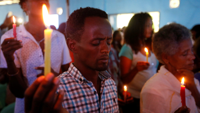 People attend prayer session at Biftu Bole Lutheran Church during a prayer and candle ceremony for protesters who died in the town of Bishoftu a week ago during Ireecha, the thanksgiving festival for the Oromo people, Addis Ababa, Ethiopia, October 9, 2016.