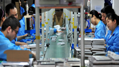 Employees work on a production line manufacturing lithium battery products