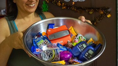 A large bowl of candy and toys