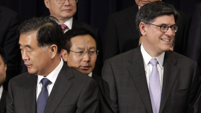 Chinese Vice Premier Wang Yang (L) and U.S. Treasury Secretary Jack Lew participate in the family photo during the U.S.-China Strategic and Economic Dialogue (S&ED) at the State Department in Washington July 10, 2013. REUTERS/Yuri Gripas