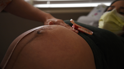 A pregnant woman visited by a nurse