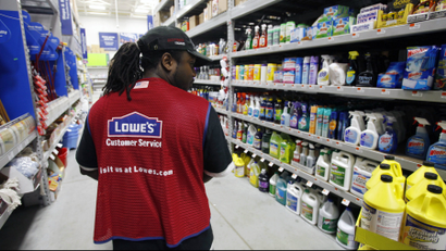 A Lowe's employee walks down an aisle in the store in Saugus, Massachusetts.