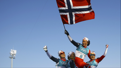 Winner Marit Bjoergen of Norway waves the Norwegian flag at Pyeongchang 2018 Winter Olympics