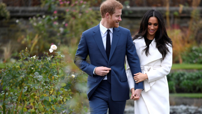 Britain's Prince Harry poses with Meghan Markle in the Sunken Garden of Kensington Palace, London, Britain