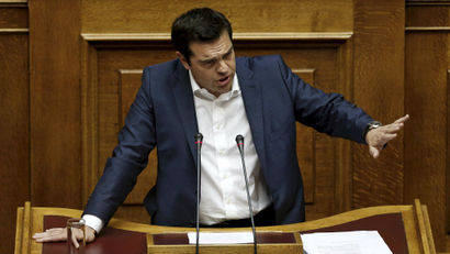 Greek Prime Minister Alexis Tsipras delivers a speech during a parliamentary session to brief lawmakers over the ongoing talks with the country's lenders.