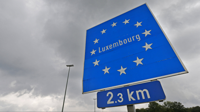 A Luxembourg road sign is seen at the border between Belgium and Luxembourg.