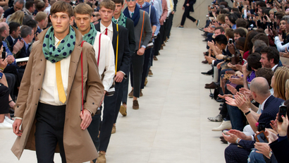 Models present creations by Burberry Prorsum during the Spring/Summer 2014 London Collections: Men fashion event in London on June 18, 2013.