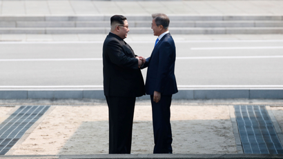South Korean President Moon Jae-in and North Korean leader Kim Jong Un meet in the truce village of Panmunjom inside the demilitarized zone separating the two Koreas, South Korea, April 27, 2018.