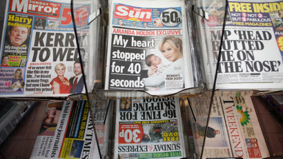 Copies of the Sun on Sunday are displayed for sale, on the first day of publication, in a newsagents in Wembley, north London