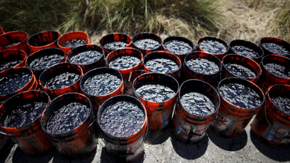 Buckets of oil volunteers carried from an oil slick along the coast of Refugio State Beach are seen in Goleta, California.