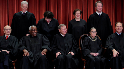 US Supreme Court justices Nov. 30. Seated (L-R): Stephen Breyer, Clarence Thomas, John G. Roberts, Ruth Bader Ginsburg and Samuel Alito, Jr. Standing behind (L-R): Neil Gorsuch, Sonia Sotomayor, Elena Kagan, and Brett Kavanaugh.