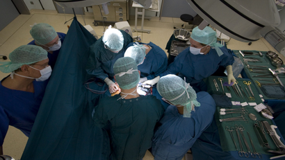 Surgeons extract the liver and kidneys of a brain-dead woman for transplantation donation at the UKB hospital in Berlin