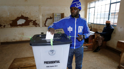 A man casts his vote at a polling station during a presidential election re-run in Nairobi, Kenya October 26, 2017.