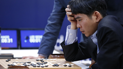 South Korean professional Go player Lee Sedol reviews the match after finishing the third match of the Google DeepMind Challenge Match against Google's artificial intelligence program, AlphaGo, in Seoul, South Korea, Saturday, March 12, 2016.