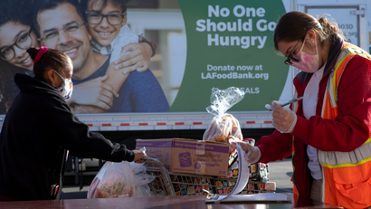 The Los Angeles Regional Food Bank distributes food outside a church.