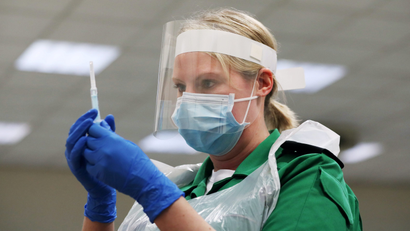 A St John's Ambulance volunteer holds a syringe during a coronavirus disease (COVID-19) vaccinator training course at the Princess Anne Training Centre in Derby