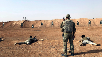 Members of the Maghawir al-Thawra Syrian opposition group receive firearms training from U.S. Army Special Forces soldiers at the al-Tanf military outpost in southern Syria on Monday, Oct. 22, 2018.