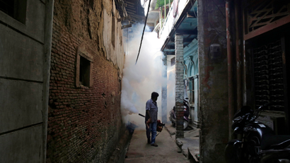 An Indian health worker fumigates an area in order to prevent the spread of mosquito-borne diseases in Allahabad, India, Wednesday, Sept. 14, 2016. Despite efforts, including spraying vast areas with clouds of diesel smoke and insecticide, several Indian cities battle dengue fever and other mosquito-borne diseases like chikungunya every year during and after the rainy season. (AP Photo/Rajesh Kumar Singh)