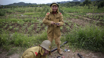 Actors get dressed in historical Japanese army uniform costumes, minutes after playing small roles as Chinese soldiers on the set of "The Last Prince" television series on location near Hengdian World Studios near Hengdian July 24, 2015. Extras and actors with smaller roles often take care of their own costumes and play more than one character in this production about the war against Japan. Director Li Xiaoqiang said the series is about a Qing Dynasty prince, who joined the Chinese nationalist army after suffering family misfortune. "After he learnt more about the Communist Party, the prince began to understand what real revolution and the anti-Japanese war meant, and turned to the Communist Party to fight Japan", the director added. According to local media, more than 10 new movies, 12 TV dramas, 20 documentaries and 183 war-themed stage performances will be released in China to coincide with the 70th anniversary of the end of World War Two.