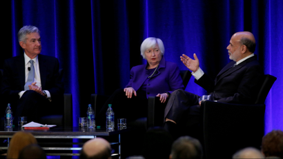 : U.S. Federal Reserve Chairman Jerome Powell and former Fed Chair Janet Yellen look on as former Fed Chairman Ben Bernanke speaks at the American Economic Association meetings