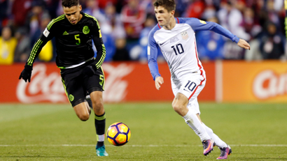 United States' Christian Pulisic plays against Mexico during a World Cup qualifying soccer match Friday, Nov. 11, 2016, in Columbus, Ohio.