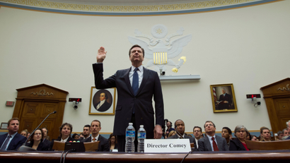 FBI Director James Comey is sworn in on Capitol Hill in Washington, Tuesday, March 1, 2016, prior to testifying before the House Judiciary Committee hearing on 'The Encryption Tightrope: Balancing Americans' Security and Privacy.' ( AP Photo/Jose Luis Magana)