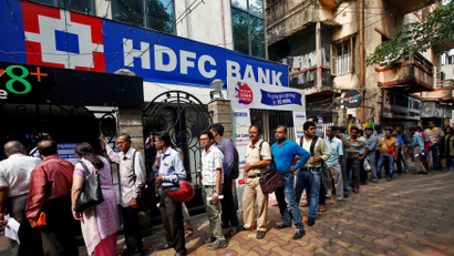 People wait to enter HDFC bank in Kolkata