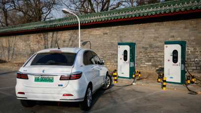 Mandatory Credit: Photo by Roman Pilipey/EPA-EFE/REX/Shutterstock (9334986g) An electric car with an exclusive license plate is charged at an electric vehicle charging station in Beijing, China, 26 January 2018. Exclusive green license plates for new energy vehicles are planned to be expanded in China in the first half of 2018, following the goal to ban fossil fuel-powered cars in the future while promoting hybrids and electric vehicles. Exclusive green license plates for new energy vehicles in China, Beijing - 26 Jan 2018